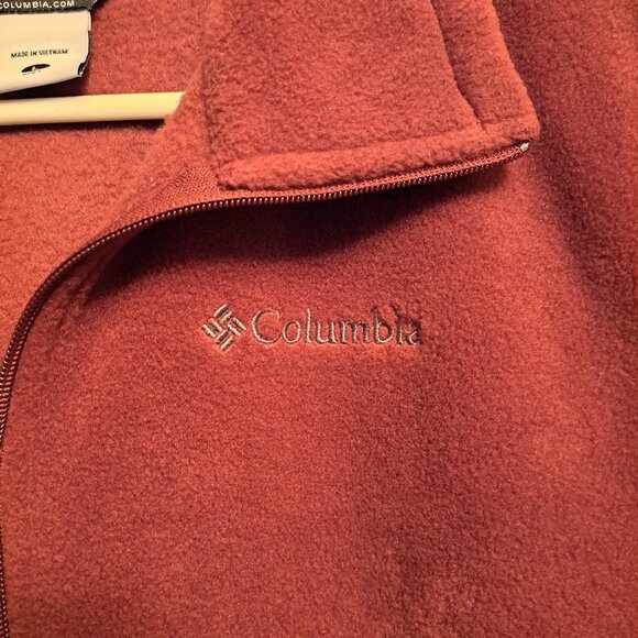 Columbia fleece vest in a burnt orange or rust color. - Picture 3 of 7